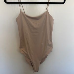 tan body suit